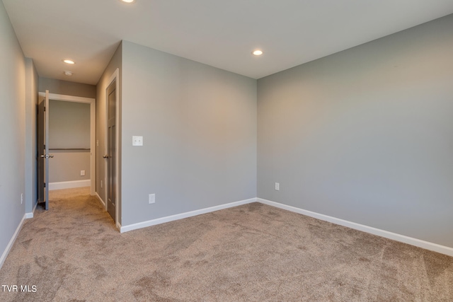 empty room featuring light colored carpet