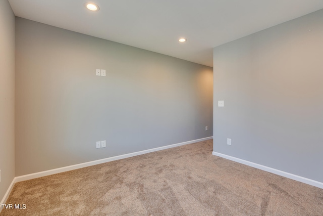 empty room featuring light colored carpet