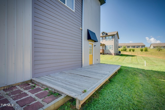 wooden deck featuring a yard