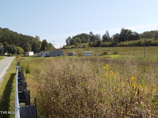 view of yard with a rural view