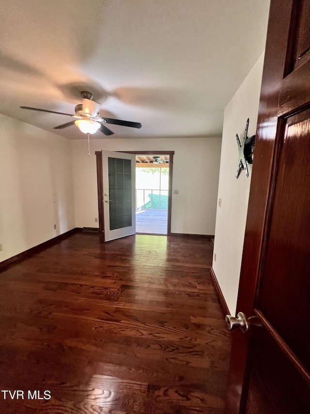 246 Keenburg Rd, Elizabethton, TN 37643 - unfurnished room with baseboards, a ceiling fan, and wood finished floors
