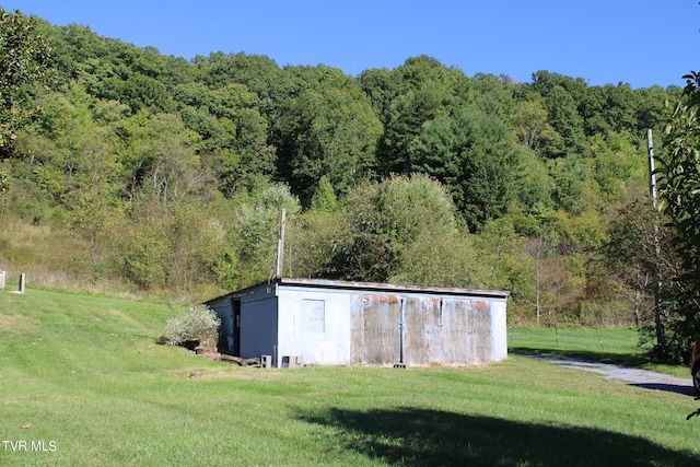 view of outbuilding with a lawn