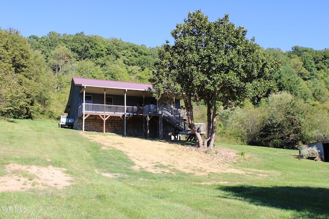 246 Keenburg Rd, Elizabethton, TN 37643 - view of front of house with a view of trees, stairway, a porch, metal roof, and a front yard