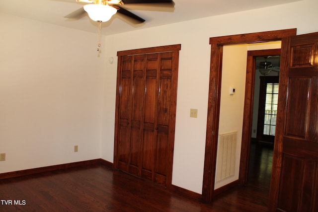 246 Keenburg Rd, Elizabethton, TN 37643 - unfurnished bedroom featuring ceiling fan, a closet, visible vents, wood finished floors, and baseboards
