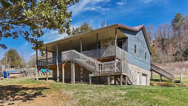 246 Keenburg Rd, Elizabethton, TN 37643 - rear view of property featuring a lawn, stairs, stone siding, and an attached garage