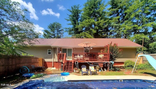 rear view of house with a deck