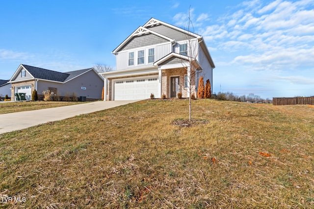 view of front of home with a garage and a front lawn