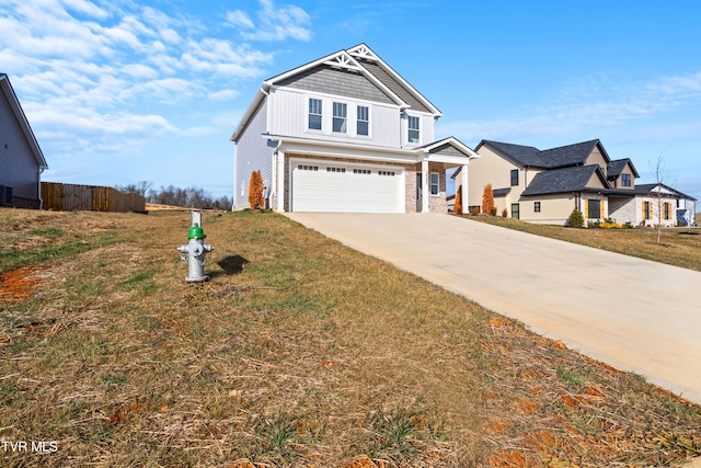 craftsman inspired home with a garage and a front yard