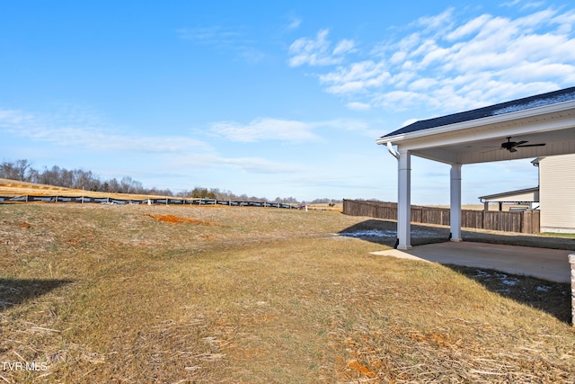 view of yard featuring a patio and ceiling fan