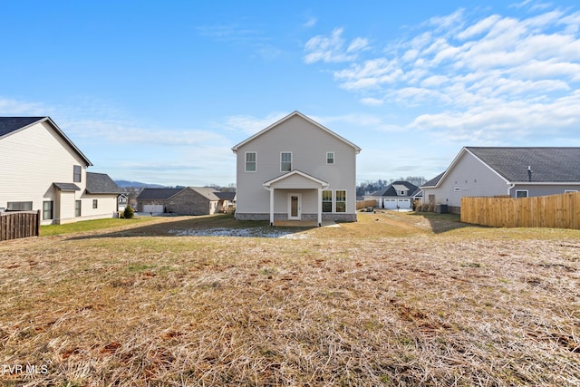 back of house with a yard