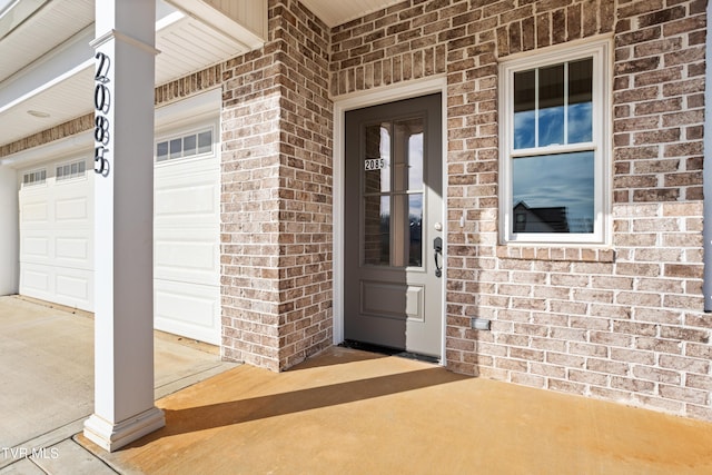 doorway to property featuring a garage