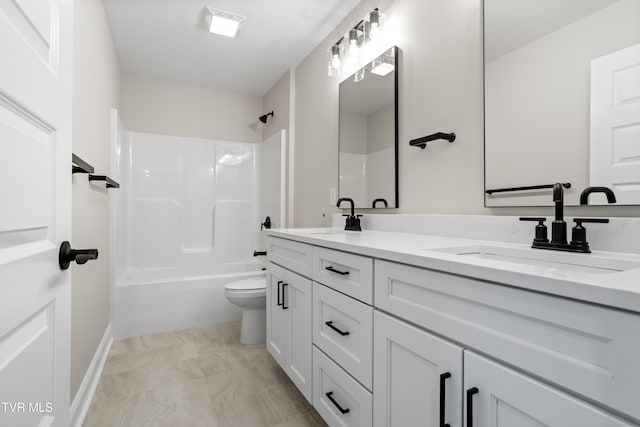 full bathroom featuring washtub / shower combination, vanity, and toilet