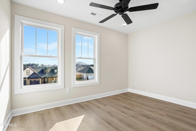 unfurnished room with light hardwood / wood-style floors and ceiling fan