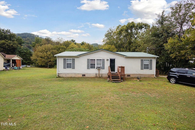 manufactured / mobile home with a front lawn