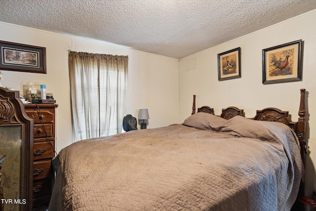 bedroom featuring a textured ceiling