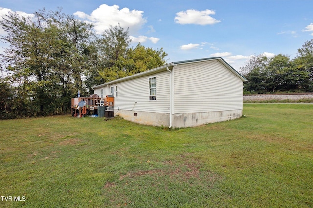 view of property exterior with a deck, a lawn, and central air condition unit