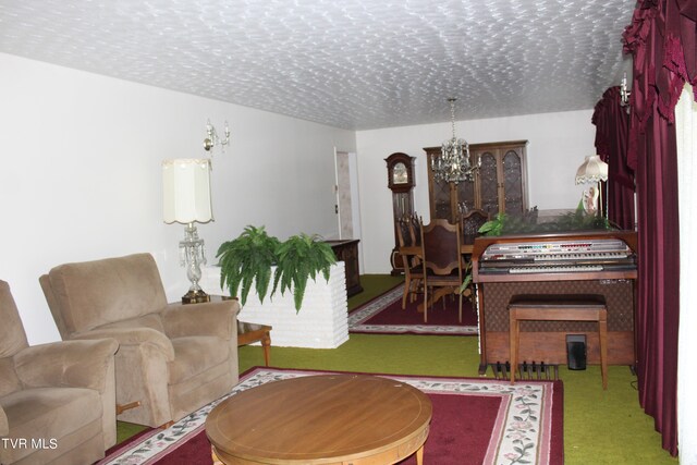 living room with a notable chandelier, a textured ceiling, and carpet floors