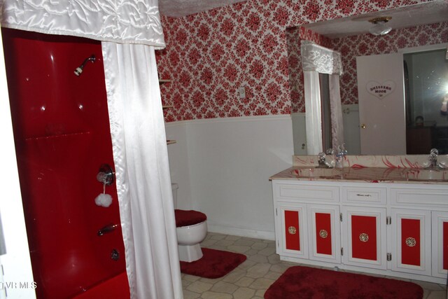 bathroom featuring vanity, a shower, and toilet