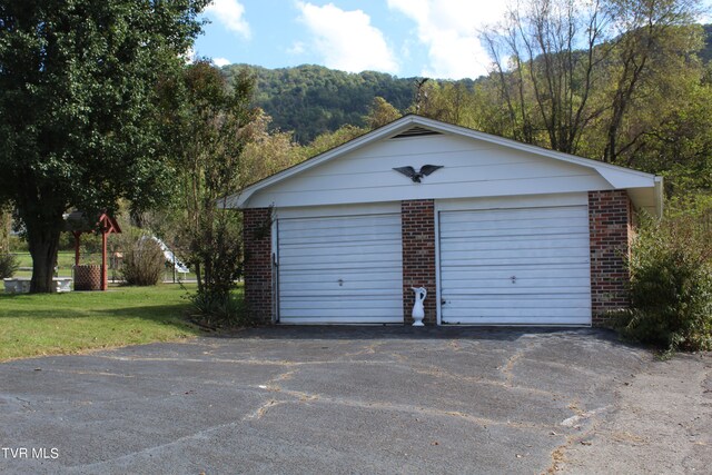 garage featuring a yard