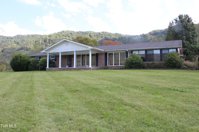 ranch-style house with a front yard