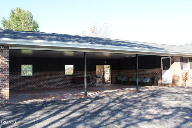 view of vehicle parking featuring a carport