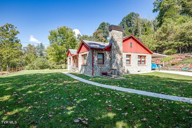 view of side of home featuring a yard