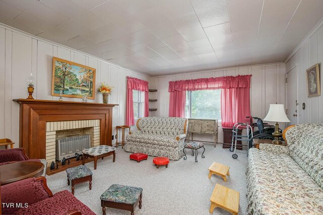 carpeted living room with a fireplace