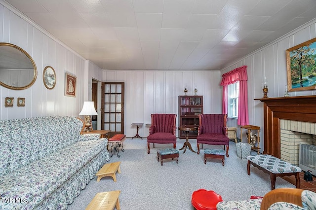 carpeted living room featuring a fireplace