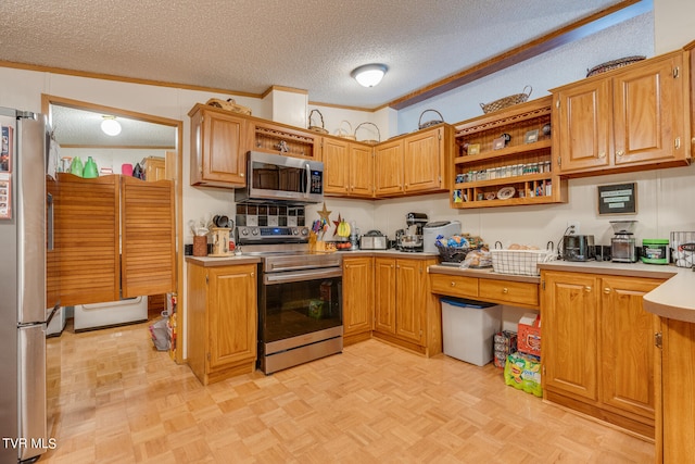 kitchen featuring appliances with stainless steel finishes, light parquet flooring, a textured ceiling, crown molding, and lofted ceiling