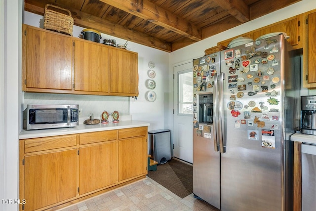 kitchen featuring wooden ceiling, beam ceiling, and stainless steel appliances