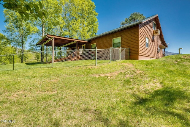 rear view of house featuring a yard