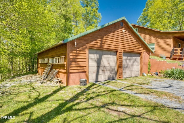 exterior space with a lawn and wood walls