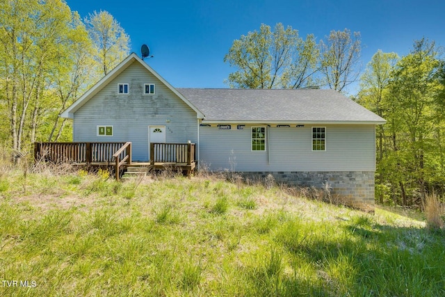 back of property featuring a wooden deck