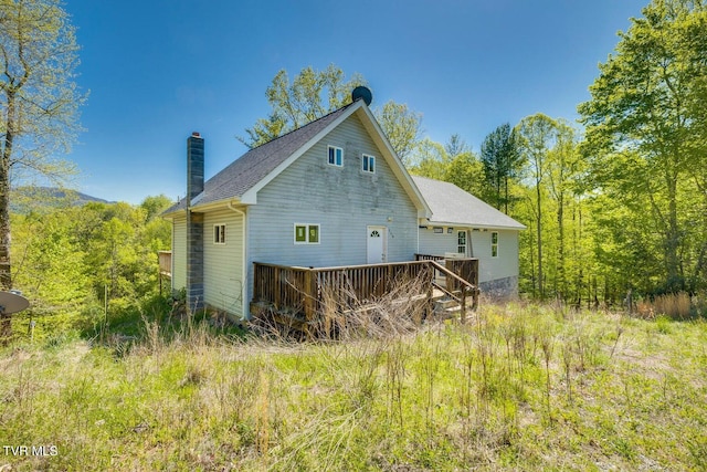 view of property exterior featuring a deck