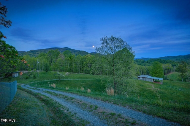 mountain view featuring a rural view