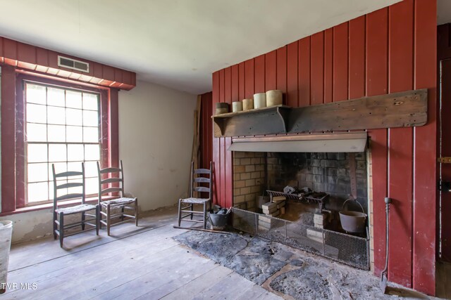 2666 Main St, Surgoinsville, TN 37873 - living room with a fireplace, visible vents, and wood-type flooring