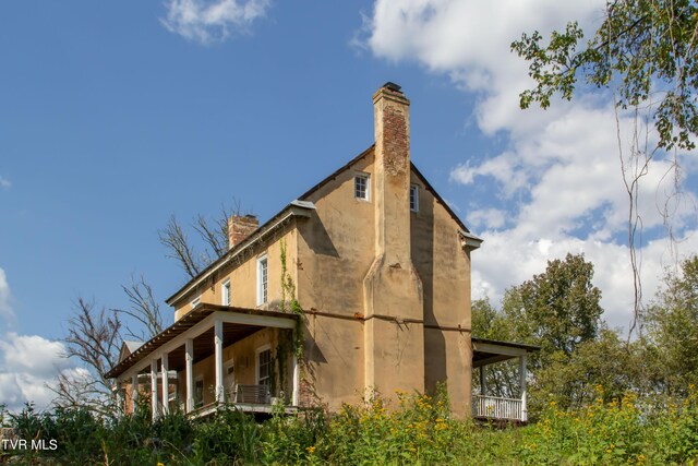 2666 Main St, Surgoinsville, TN 37873 - view of home's exterior featuring a chimney