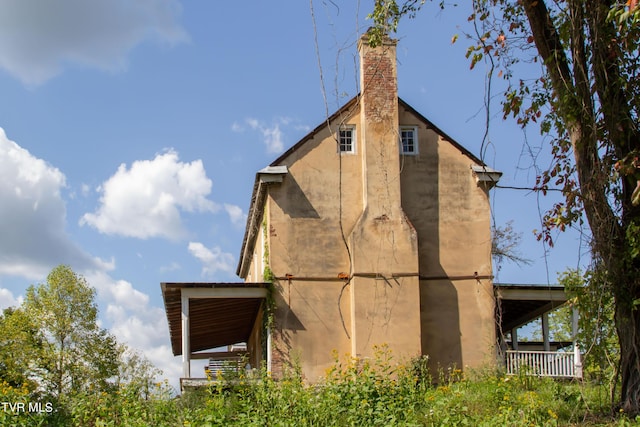 2666 Main St, Surgoinsville, TN 37873 - view of home's exterior featuring a chimney