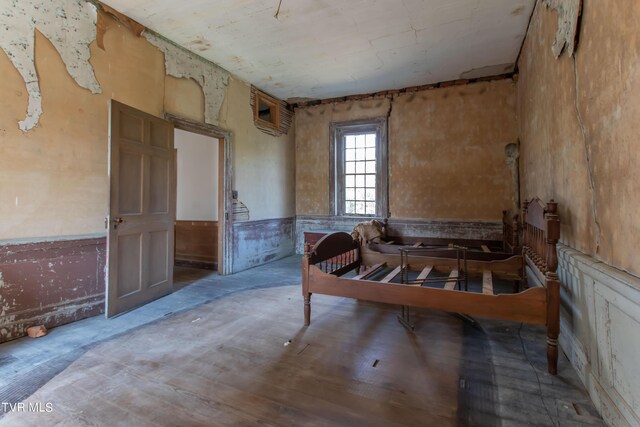 2666 Main St, Surgoinsville, TN 37873 - bedroom with wood finished floors and wainscoting