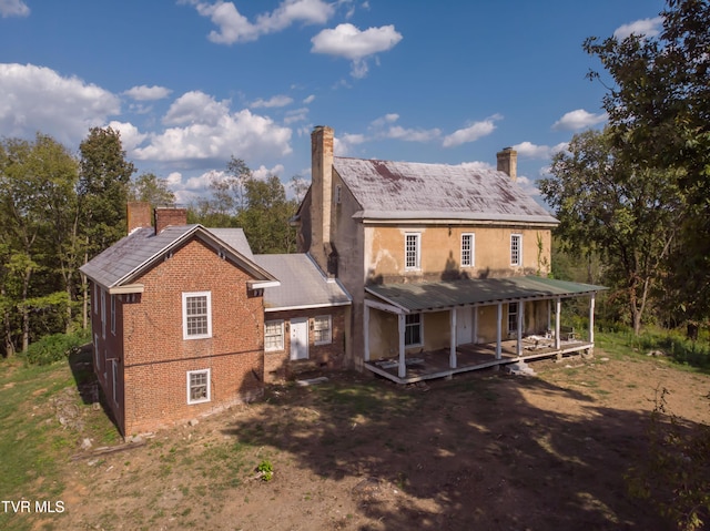 2666 Main St, Surgoinsville, TN 37873 - back of house featuring a chimney and brick siding