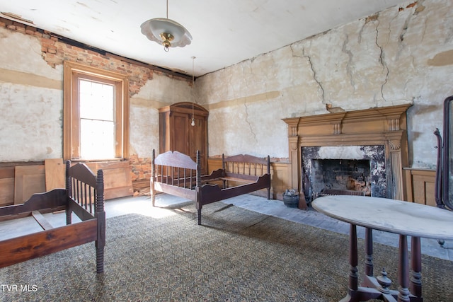 bedroom with a premium fireplace