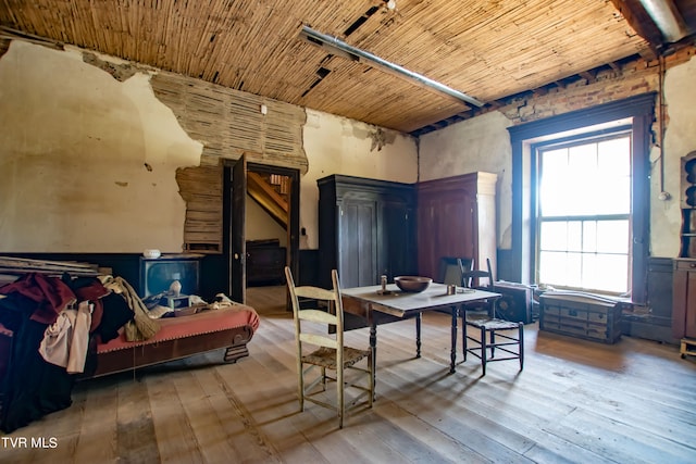 interior space with wood ceiling and hardwood / wood-style flooring