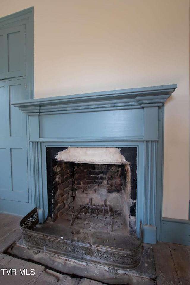 2666 Main St, Surgoinsville, TN 37873 - interior details featuring a fireplace with raised hearth and wood finished floors