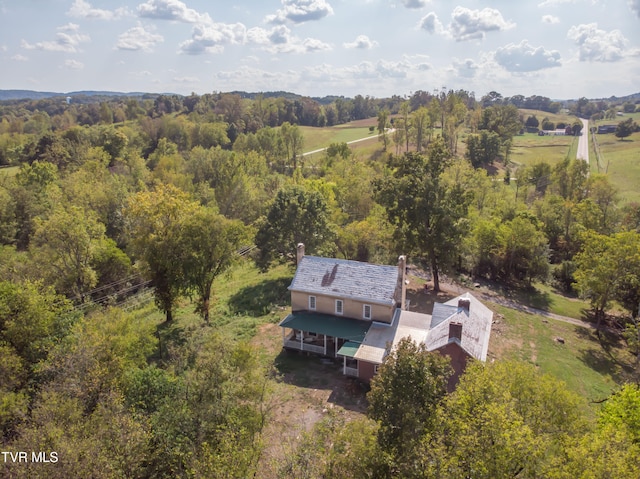 birds eye view of property with a rural view