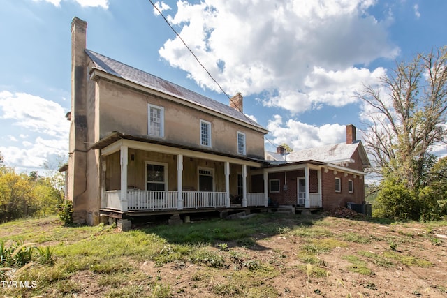 2666 Main St, Surgoinsville, TN 37873 - view of front of house featuring central AC unit, a chimney, and covered porch