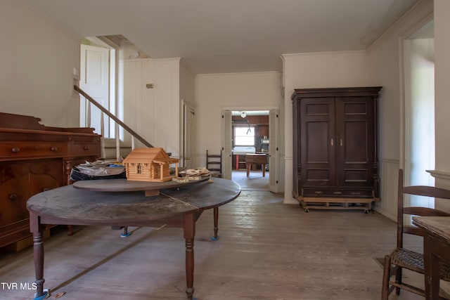 2666 Main St, Surgoinsville, TN 37873 - dining space featuring light wood-type flooring, ornamental molding, and wainscoting
