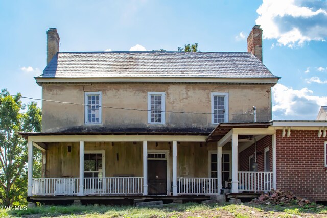 2666 Main St, Surgoinsville, TN 37873 - rear view of house featuring a chimney and covered porch