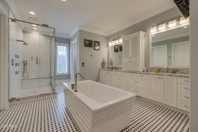 bathroom featuring plus walk in shower, tile patterned floors, vanity, and crown molding