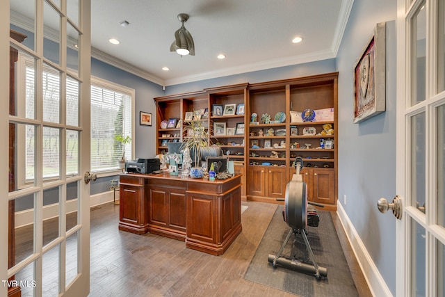 office area with ornamental molding, light hardwood / wood-style flooring, and french doors