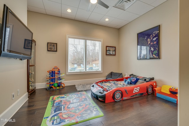 bedroom featuring ceiling fan and dark hardwood / wood-style flooring